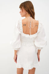 Sweet and irresistible ~ Introducing the Tiana Mini Dress from For Love & Lemons. Self: 100% Cotton; Embroidery: 100% Polyester; Lining: 100% Cotton   Rose eyelet Halter ties Rosettes details Ruffle trim details Gathered waistline Long puff sleeves Invisible zip closure Eco Dry Clean recommended. Avoid cleaners that use harmful chemicals like "perc".
