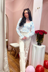 Far out, dude! The Far Out is a High Rise Relaxed Flare with a side slit. Sometimes you need a little bit of everything, so The Far Out in Raw Cut is made using our 11oz Just Right fabric. It is the perfect mix of rigid and stretch, built into modern silhouettes with vintage character. Reliably flattering, consistently kind. Paired here with our Market Mornings Sweater and You're the Pearl Bootie.