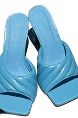 Feelin' blue? Throw on this perfect open toe mule to turn any day around and make it one to remember! Featuring a square toe, pleated strap and 4 inch heel, these beauties can elevate any look, be it casual or classy. Our Feelin' Blue Mule is shown here with our Spring Showers Mini Dress and I think I like you Pink Set.  Runs true to size Comfort sole 4 inch heel Square toe