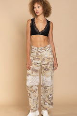 Truly a work of art, and you'll be a work of art in it...this lace halter racerback bralette is as stunning as it is practical. Featuring allover lace detailing that provides the perfect peek-a-boo to any tank, a sultry halter neckline and flattering and supportive racerback with lace detailing, this will be a new favorite in your intimates drawer! Runs true to size, model wearing size small 94% Rayon, 6% Spandex Adjustable strap at back Partially lined