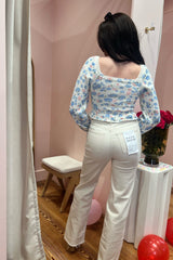 Far out, dude! The Far Out is a High Rise Relaxed Flare with a side slit. Sometimes you need a little bit of everything, so The Far Out in Raw Cut is made using our 11oz Just Right fabric. It is the perfect mix of rigid and stretch, built into modern silhouettes with vintage character. Reliably flattering, consistently kind. Paired here with our Market Mornings Sweater and You're the Pearl Bootie.