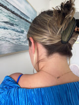 Just selling seashells by the seashore... wearing this precious hair clip! Perfect to get yourself in that vacay spirit no matter where you're at, these functional and on point hair clips will be your go-to accessory this summer.  Measure approximately 3.25" x 2.5" x 2.5"  Gold tone hardware Medium to large capacity hair hold