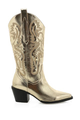 The boot of the season has arrived, and these metallic beauties are made for way more than just walking! The Danilo by Billini is a long western boot that gives the perfect touch of western inspired styling to your everyday, festival, or game day look!   If in between sizes, we recommend sizing up Heel height 7 cm Low stacked block heel Closed pointed toe Structured upper Western inspired embroidery Oversized side pull tabs for a pull on design Synthetic upper, lining and outsole