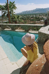 Made from 100% cotton canvas with a violet floral print, our new wide-brimmed holiday bucket is finished with a simple and secure necktie, ensuring this hat goes everywhere you do.