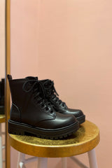 Perfectly suited for all of your rendezvous (or for hitting up Magazine Street's very own Rendezvous), these classic combat boots are here to edge up your look or provide the perfect contrast to your flirty, feminine dresses. Featuring a classic Doc Marten design with a convenient side zip detail, these gems will last you for years to come and get better with every wear.