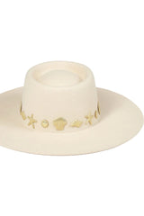 Chic to the core and now available as our limited edition ‘Summer of Sun’ hat. Featuring our classic ivory dipped boater silhouette with custom made gold Lack of Color seaside conchos. Unforgettable. Always wearable.