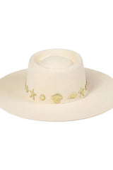 Chic to the core and now available as our limited edition ‘Summer of Sun’ hat. Featuring our classic ivory dipped boater silhouette with custom made gold Lack of Color seaside conchos. Unforgettable. Always wearable.