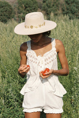Chic to the core and now available as our limited edition ‘Summer of Sun’ hat. Featuring our classic ivory dipped boater silhouette with custom made gold Lack of Color seaside conchos. Unforgettable. Always wearable.