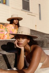 Chic to the core and now available as our limited edition ‘Summer of Sun’ hat. Featuring our classic ivory dipped boater silhouette with custom made gold Lack of Color seaside conchos. Unforgettable. Always wearable.