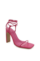 The Toniro by Billini is strappy high block heel. A go-to for any occasion, this strappy stiletto works for weddings, formals, parties and more!  Runs true to size Heel height 10.5cm. High shaved block heel Open square toe with thin, tubular toe strap Wrap around lace up ankle fastening Statement knot detailing Exposed heel counter Synthetic lining and outsole