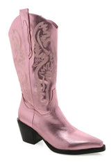The boot of the season has arrived, and these metallic beauties are made for way more than just walking! The Danilo by Billini is a long western boot that gives the perfect touch of western inspired styling to your everyday, festival, or game day look!   If in between sizes, we recommend sizing up Heel height 7 cm Low stacked block heel Closed pointed toe Structured upper Western inspired embroidery Oversized side pull tabs for a pull on design Synthetic upper, lining and outsole