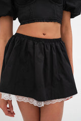 Rose love ~ introducing the Maye Mini Skirt from For Love & Lemons. Self: 100% Cotton; Embroidery 100% Polyester; Lining: 90% Polyester 10% Spandex.   Rose embroidery Elastic waistband Full skirt trimmed Lace hemline Built in boy shorts Eco Dry Clean recommended. Avoid cleaners that use harmful chemicals like "perc".
