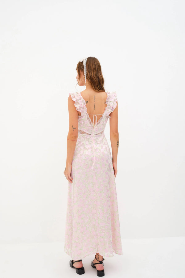 Beauty in bloom ~ Introducing the Estelle Maxi Dress from For Love & Lemons. Self: 60% Viscose/40% Polyester; Lining: 100% Recycled Polyester; Blush blooms burn-out Ruffle trimmed shoulder straps with skinny tie detail Delicate inset lace along neckline & waist Low cut back with functional skinny tie Fully lined in chiffon Invisible zip closure  Eco Dry clean recommended. Avoid cleaners that use harmful chemicals like "perc".