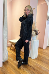 You're on the move, so don't let your outfit hold you back! This perfect pleated set is truly made for doing it all and confidently ensuring that you look effortlessly put together while doing so! Ultra soft, lightweight satin fabric with a super flattering pleated texture throughout, the pants feature a relaxed fit with subtle flare and the top is a classic, relaxed fit button down blouse.