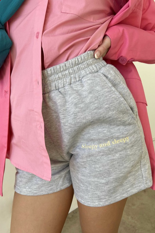Tell it how it is in our perfectly soft yet effortlessly cute Sleepy + Sleepy Embroidered Sweat Shorts! Featuring an ideal mid-thigh length, front and back pockets, and an elastic waist band, these will be the shorts you're wearing all year long. Our Sleepy + Sleepy Embroidered Sweat Shorts are shown here with our Sleepy + Sleepy Embroidered Zip Up Hoodie.