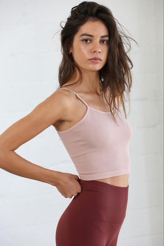 This comfy and seamless criss cross back cami is giving us all the Free People vibes! Its' stretchy and high quality material will have you wearing this piece from morning workout to Sunday brunch.  Supportive fit, runs true to size  X-back detail Seamless
