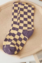 It doesn't get much comfier than these adorably on trend checkered socks! Featuring lightweight, breathable cotton and the perfect right above the ankle height, these will be your favorites for years to come.  One size fits most 75% Cotton, 25% Nylon Hit above the ankle