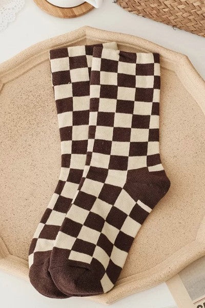 It doesn't get much comfier than these adorably on trend checkered socks! Featuring lightweight, breathable cotton and the perfect right above the ankle height, these will be your favorites for years to come.  One size fits most 75% Cotton, 25% Nylon Hit above the ankle