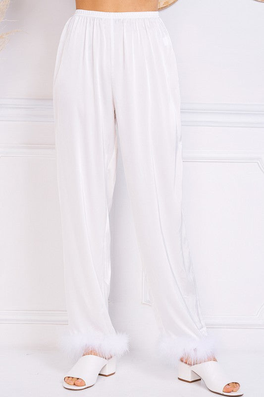 It doesn't get much better than our Sleepin' In Satin Fur Trimmed Lounge Pants! With their lightweight satin fabric, elastic waistband and wide leg design complete with fur trim, these are guaranteed to be your new favorite pajama pants. We won't even blame you if you wear them out on the town, because they are THAT good! Complete the set with our Sleepin' In Satin Fur Trimmed Button Down.