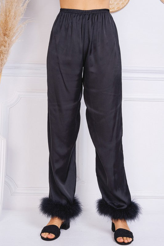 It doesn't get much better than our Sleepin' In Satin Fur Trimmed Lounge Pants! With their lightweight satin fabric, elastic waistband and wide leg design complete with fur trim, these are guaranteed to be your new favorite pajama pants. We won't even blame you if you wear them out on the town, because they are THAT good! Complete the set with our Sleepin' In Satin Fur Trimmed Button Down.