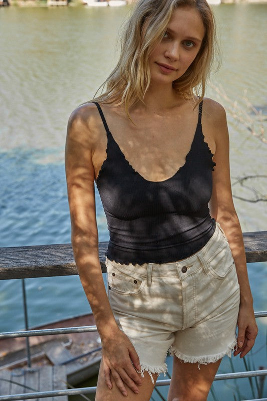 Say hello to your new favorite staple, back and better than ever in new colors... our seamless scalloped ribbed cami is a guaranteed must-have! Ideal for layering or all by itself, this piece features the softest ribbed knit, a v-neckline, and scalloped edge throughout. 