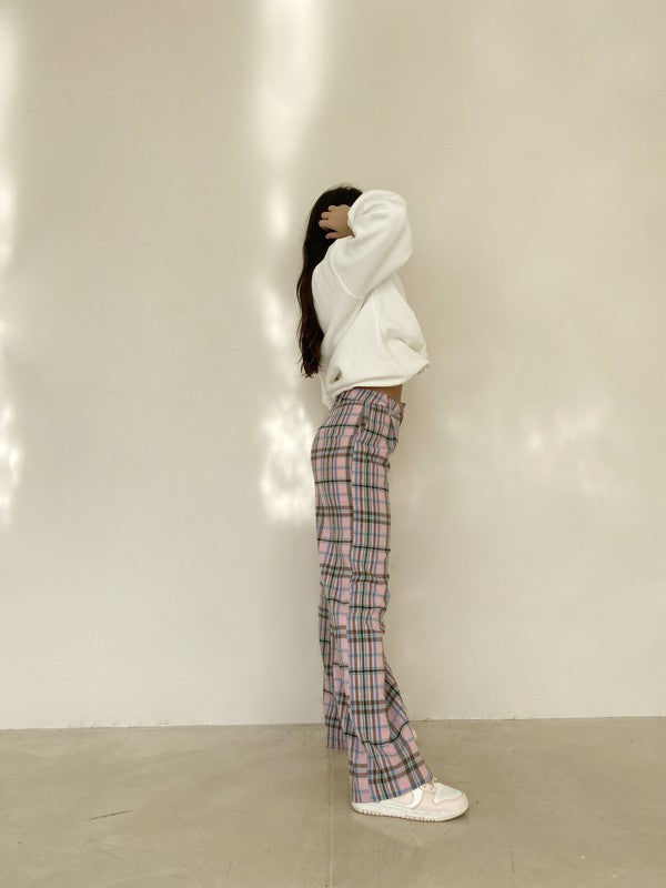 I mean... we're definitely not mad about these perfect plaid cotton pants! Featuring a classic, pleated trouser silhouette, high rise, straight leg fit, and perfectly pastel retro colorway, these babies can truly do it all from the office to your weekend brunch.  Runs true to size, model wearing size extra small Self: 55% Cotton, 45% Polyester; Lining: 100% Rayon Fully lined Front pockets