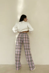 I mean... we're definitely not mad about these perfect plaid cotton pants! Featuring a classic, pleated trouser silhouette, high rise, straight leg fit, and perfectly pastel retro colorway, these babies can truly do it all from the office to your weekend brunch.  Runs true to size, model wearing size extra small Self: 55% Cotton, 45% Polyester; Lining: 100% Rayon Fully lined Front pockets