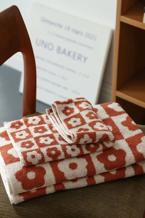 Get ready to Vacay Away and make sure you bring this precious beach towel! Featuring ultra absorbent, water wicking cotton material, a resort size and on-trend playful print, this essential vacation staple is meant to be loved for years to come.  100% Cotton Measures 70 x 140 CM Multi = floral print checkered design Check = solid checkered design