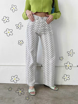 The perfect statement pant, our Ditsy Daisy Cotton pants are here to brighten any day, and can be dressed up or down accordingly. Featuring a high rise, classic straight leg fit, fun floral print, and perfectly worn in, lightweight cotton feel, you'll be living in these!  Runs true to size, model wearing size small Self: 100% Cotton; Lining: 90% Cotton, 10% Polyester Four pocket style