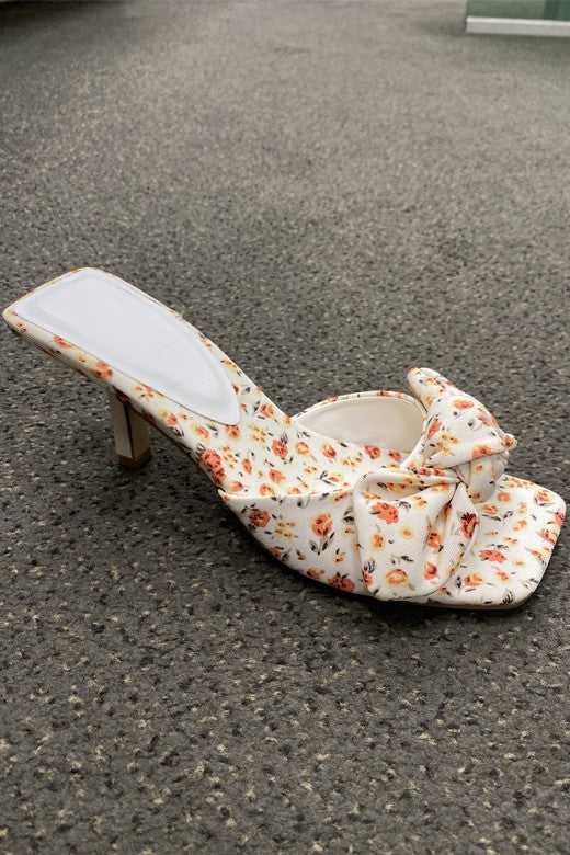Whether you're all about the solids and are on the hunt for a pop of print to elevate your look, or you've mastered the trend of clashing prints (truly an art form), these floral print mules are here for you! Featuring a 3 inch heel, square toe and knot bow detail, these beauties are meant to take you all the way from brunch to date night.