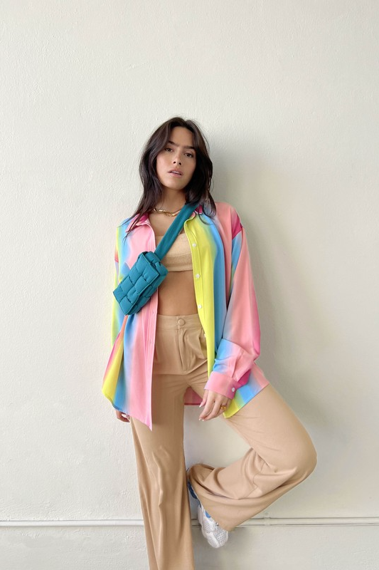 Taste the rainbow... this perfect, relaxed fit button down is here to add that much needed pop of color to your wardrobe. Throw it on to brighten up any day at the office, open it up over your go-to bralette for that post-work happy hour, and toss it in your suitcase for the perfect swim cover up - this piece can truly do it all!  Relaxed, oversized fit. If you'd like a smaller fit, we recommend sizing down. Model wearing size small 100% Polyester Unlined Collar Functional button front