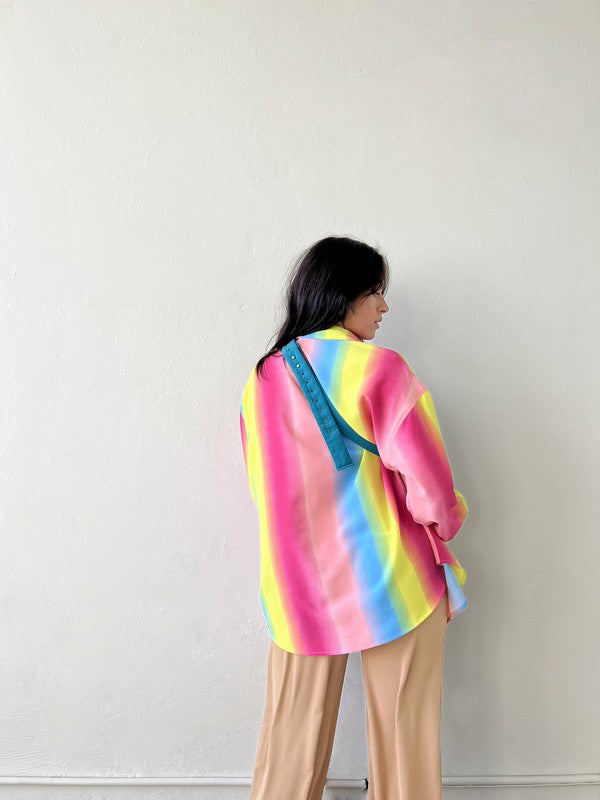 Taste the rainbow... this perfect, relaxed fit button down is here to add that much needed pop of color to your wardrobe. Throw it on to brighten up any day at the office, open it up over your go-to bralette for that post-work happy hour, and toss it in your suitcase for the perfect swim cover up - this piece can truly do it all!  Relaxed, oversized fit. If you'd like a smaller fit, we recommend sizing down. Model wearing size small 100% Polyester Unlined Collar Functional button front