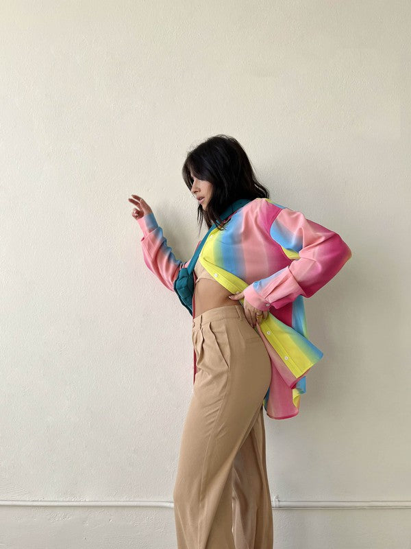 Taste the rainbow... this perfect, relaxed fit button down is here to add that much needed pop of color to your wardrobe. Throw it on to brighten up any day at the office, open it up over your go-to bralette for that post-work happy hour, and toss it in your suitcase for the perfect swim cover up - this piece can truly do it all!  Relaxed, oversized fit. If you'd like a smaller fit, we recommend sizing down. Model wearing size small 100% Polyester Unlined Collar Functional button front