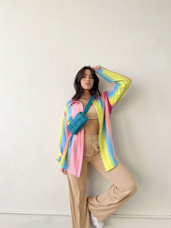 Taste the rainbow... this perfect, relaxed fit button down is here to add that much needed pop of color to your wardrobe. Throw it on to brighten up any day at the office, open it up over your go-to bralette for that post-work happy hour, and toss it in your suitcase for the perfect swim cover up - this piece can truly do it all!  Relaxed, oversized fit. If you'd like a smaller fit, we recommend sizing down. Model wearing size small 100% Polyester Unlined Collar Functional button front