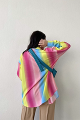 Taste the rainbow... this perfect, relaxed fit button down is here to add that much needed pop of color to your wardrobe. Throw it on to brighten up any day at the office, open it up over your go-to bralette for that post-work happy hour, and toss it in your suitcase for the perfect swim cover up - this piece can truly do it all!  Relaxed, oversized fit. If you'd like a smaller fit, we recommend sizing down. Model wearing size small 100% Polyester Unlined Collar Functional button front
