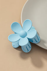 Dreamin' of Daisies? Well, throw on this precious classic hair clip to add an instant and effortless pop of color to any look. Classic claw style meets totally trendy retro daisy design.  100% Acrylic Measures about 3" Classic claw design