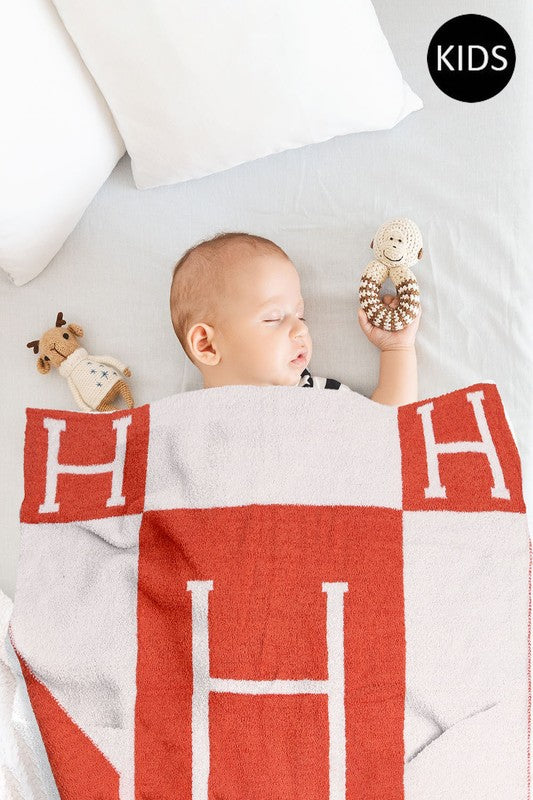 H is for Home and Home is wherever your precious little ones are, so make sure they're perfectly cozy and on trend in this precious Hermes dupe blanket. The softest microfiber fleece to guarantee your little angel has the sweetest (and most stylish) dreams. Don't forget to grab our H is for Home full size blanket for yourself!  Size : 29" X 35" Material : 100% Poly. Microfiber Care: machine wash - cold, do not bleach, lay flat to dry, do not iron, do not dry clean