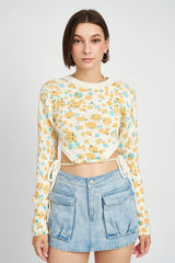 Sunsets in spring and all thing serene in this precious floral sweater! Featuring a cropped silhouette, classic crew neckline, and anything-but-classic cutouts at the waist with functional drawstring details to perfectly cinch it all together. An instant team-favorite and the perfect pre-spring transition piece.