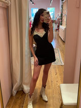 Oops, made you look in the dreamiest mini slip dress! Designed for off-duty days that seamlessly lead into flirty nights, this flattering bias-cut, soft and slinky mini is the year-round LBD slip you'll be going back to for years to come. Topped off with a romantic lace detailing and an eye-catching low back, guaranteed to have them doing double takes. Paired here with our Sweet and Southern Embroidered Boot, City Never Sleeps Vegan Leather Trench, and Stay A While Turtleneck Sweater.