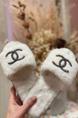 Slide on over Coco, these cozy slippers are here to stay! With a rubber sole worthy of Sunday strolls down Magazine and an ultra plush footbed, it's safe to say these slippers will be sneaking their way into our daily shoe collection.