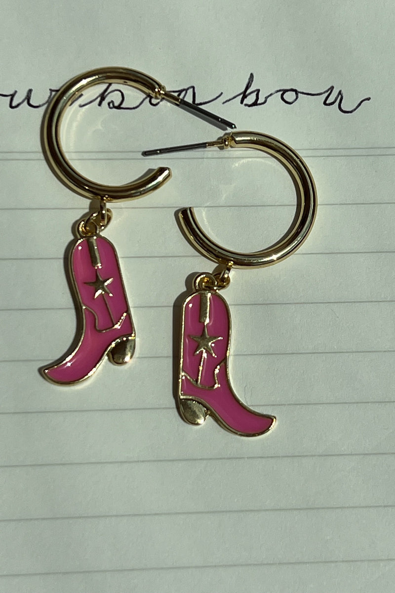 Talk about a statement... our Let's Go Cowgirl Huggies practically scream that you're here to party! The perfect pop of pink to any outfit.  Measure ~1.75" Open hoop dangle studs