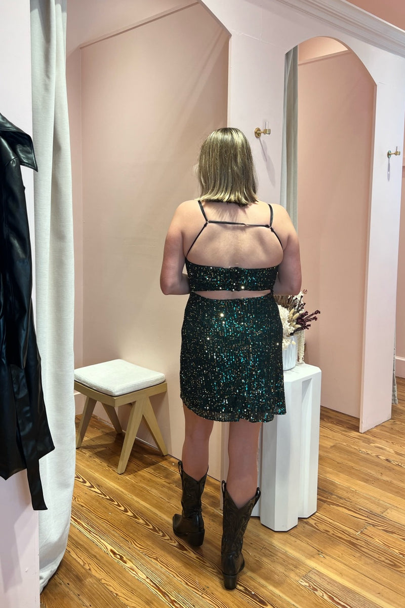 The most-loved, best-selling mini dress that had us Head Over Heels is back, better than ever and has us Seeing Sequins! Featuring a flattering bias cut, modern and edgy curve bustier detail, classic slip silhouette fully adorned by sequins and eye-catching back, this gem is a guaranteed head-turner for all things cocktail soirées, Holiday season, and Mardi Gras. Paired here with our most-loved Danilo Western Boot and City Never Sleeps Vegan Leather Trench.