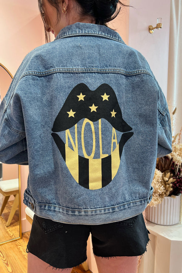 A SYBB Exclusive and our new favorite way to show some love for our most-favorite city, our NOLA Lips Denim Jacket is truly a work of art in itself. With a relaxed, classic oversized fit, vintage-inspired worn in feel and head-turning NOLA Lips decal on the back, this piece is guaranteed to be loved for years to come. Shown here with our Bottom Line Short and Tiger Girl Tee.