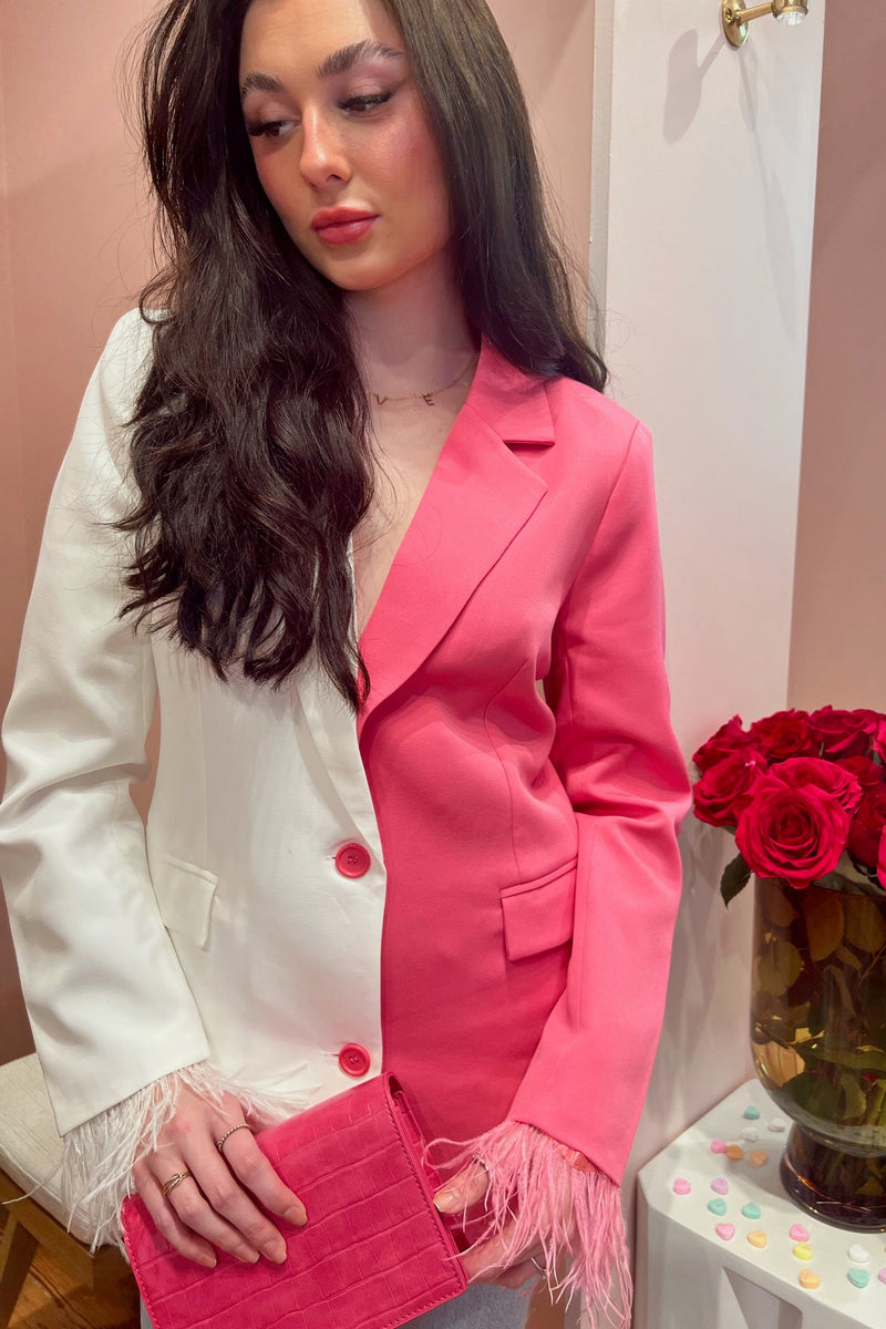 Why pick a side when you don't have to? We are loving on this color-blocked half white, half pink blazer. The cuffs are dripping with a light feather detail and the overall quality of this piece is just oh so good. You'll stand out in this one boss. Paired here with our Go Getter High Rise Flare Jean in Just Kissed, Nights like These Heel, and Laina Crossbody Bag.