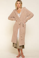 Off duty and nowhere to be, so throw on this magical tie front hooded robe and prepare for ultimate relaxation! Featured in the softest berber fleece and cut in a long cardigan silhouette, then topped off with the comfiest hood, tie detail, and the roomiest pockets ~ we guarantee you'll be living in this piece for years to come.  Runs true to size, model wearing size small 100% Polyester Matching items available