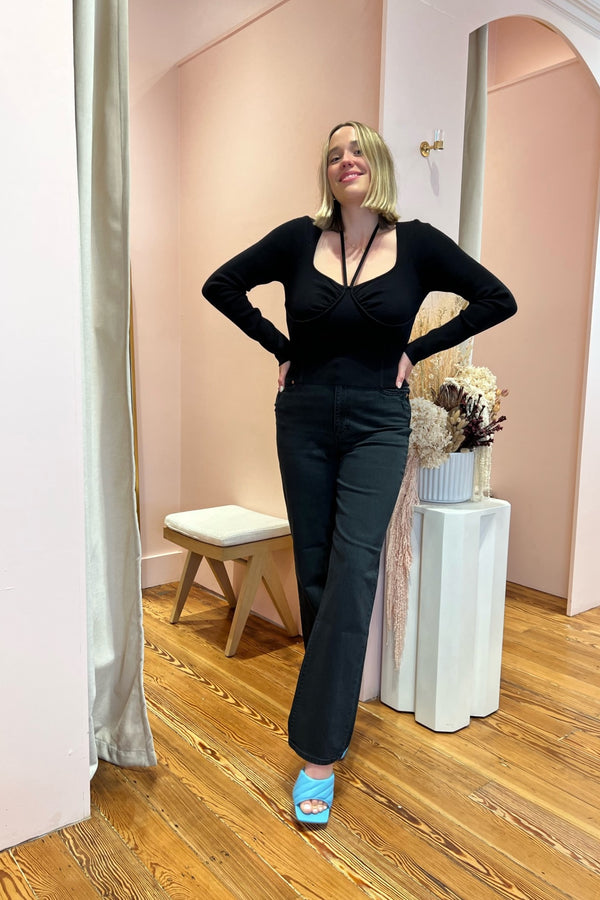 A picture perfect day ~ you in this precious ribbed bustier sweater sipping on some wine and doing a little shopping! Featuring a soft boning bustier silhouette and halter neck tie detail, this form fitting number hits perfectly at your high rise denim and will take you effortlessly from your day on the town to date night. 