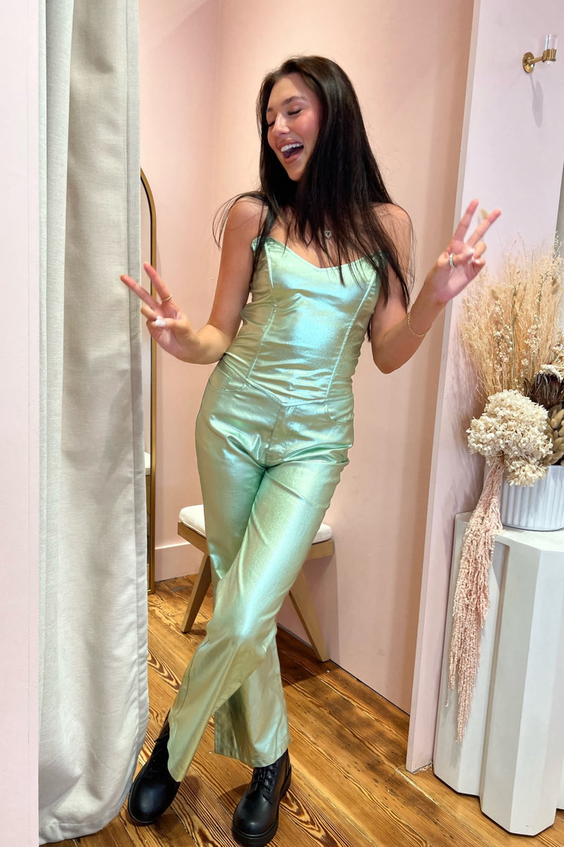 You'll be all over the Headlines in this absolutely show stopping bustier top! An instant team favorite featured in the most magical metallic mint colorway and cut in a figure flattering, curve-hugging bustier silhouette with exaggerated v-neckine, this number stuns with its matching pant or adds the perfect bit of edge to any pair of denim. A year-round statement you'll love for years to come.