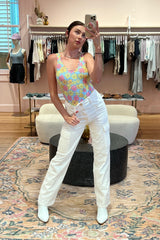 Sunny days are ahead and this precious scalloped edge swimmie will be by your side for all of them! With the sweetest allover floral print in all the best shades of summer and a flattering, scoop neck and back, this gem was made for the heat of the summer. Paired here with our Urson Boot and styled as a bodysuit.  Runs true to size, model wearing size small 82% Polyester, 18% Spandex Fully lined