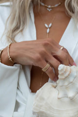 Introducing the bolder version to our most-loved Orb ring, this gem features a thick band with a beaded detail. Stack a couple for extra edge, or seamlessly layer it in with your other favorites!  Gold Filled Handmade in Costa Mesa, CA.