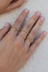 Introducing the bolder version to our most-loved Orb ring, this gem features a thick band with a beaded detail. Stack a couple for extra edge, or seamlessly layer it in with your other favorites!  Gold Filled Handmade in Costa Mesa, CA.